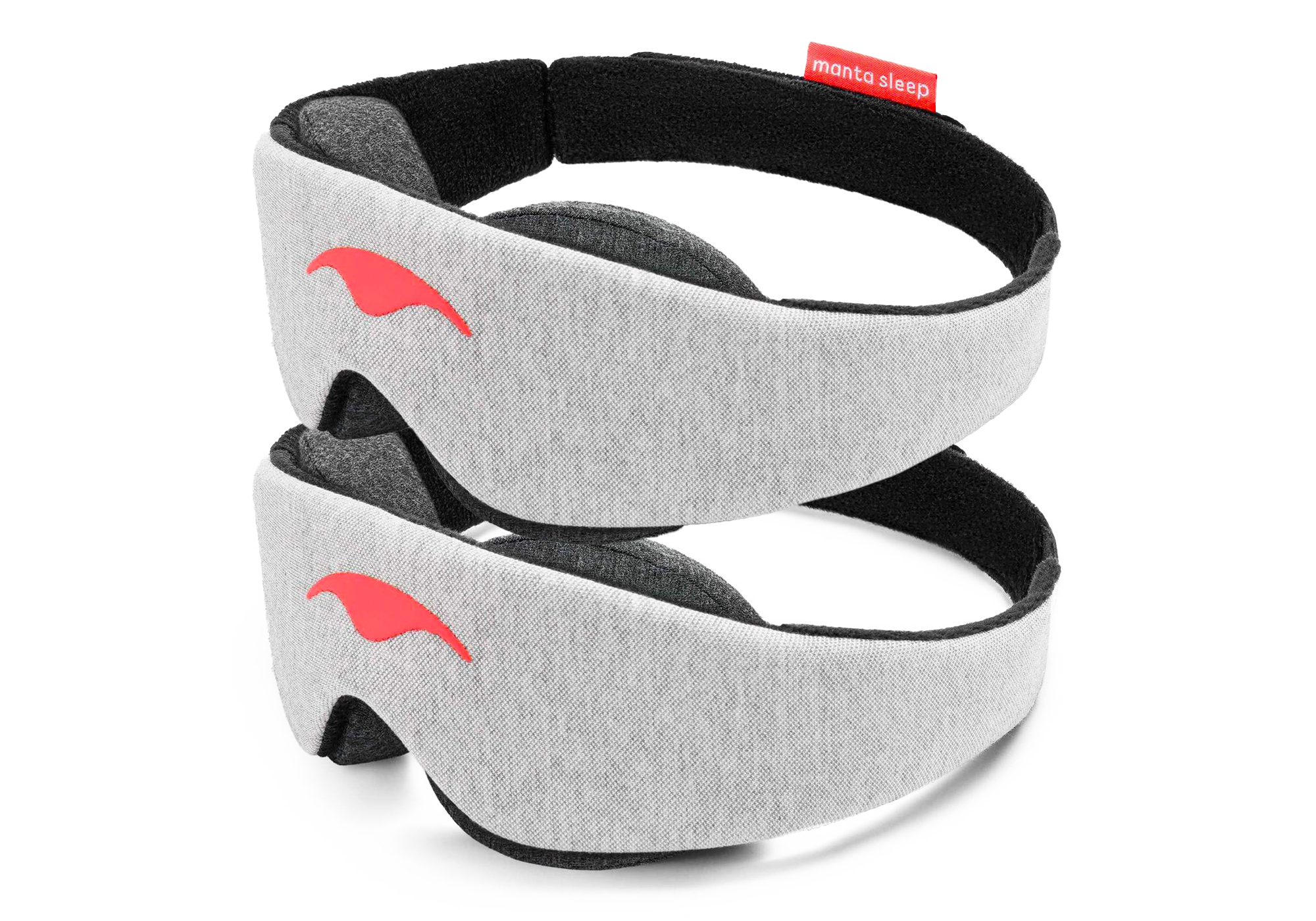 Two light gray heather fabric Manta Sleep Masks are stacked vertically against a clean white background. Both masks feature the signature smooth, coral-colored Manta Sleep logo on the center front and show a glimpse of the plush, dark gray contoured eyecups underneath the black-lined headband.