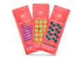 Three coral-red Manta Aroma Dots packets for Lavender, Bergamot, and Eucalyptus scents arranged in a fan shape, isolated on white.