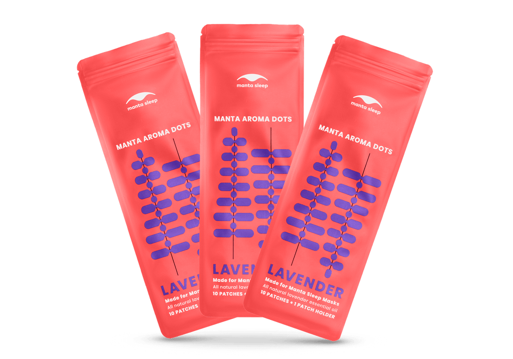 Three coral-red Manta Aroma Dots packets for the Lavender variant arranged in a fan shape, isolated on a clean white background.