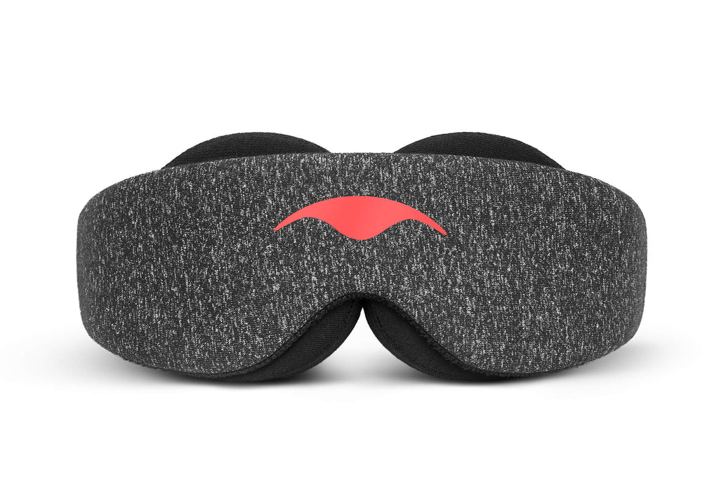 Direct front view of the Carbon Black Manta Sleep Mask laid flat against a white background, highlighting its symmetry, speckled dark gray heather fabric, and the contrasting coral-red Manta Sleep logo in the center.