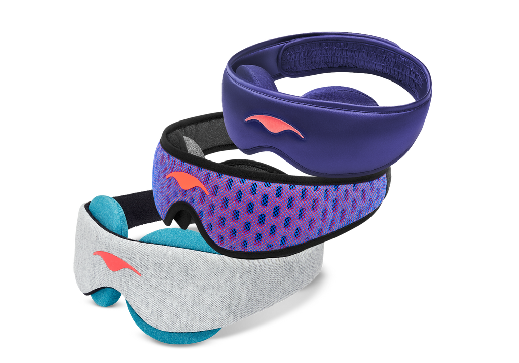 Three stacked Manta Sleep masks: a purple Manta SILK Sleep Mask on top, a blue and red Manta PRO Sleep Mask in the middle, and a grey Manta COOL Sleep Mask with blue-teal eye cups on the bottom.