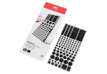 High-angle shot of a Manta Sleep Blackout sticker pack next to an open sheet filled with one hundred black light blocking stickers of different sizes.