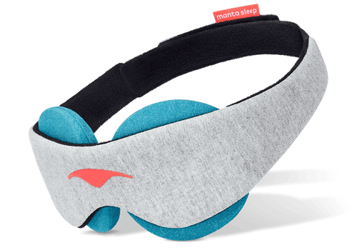 Three-quarter profile view of a grey Manta COOL Sleep Mask showing the soft blue-teal circular eye cups, isolated on white.