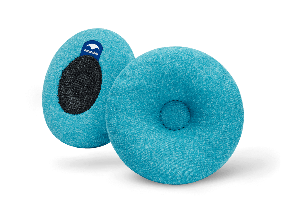 Pair of round blue-teal Manta COOL Eye Cups, showing both the indented front side and the black hook-and-loop back side on white.