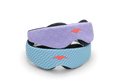Two variants of the Manta KIDS Sleep Mask stacked on top of each other against a white background. The top mask displays a purple pattern with light blue circle outlines, while the bottom mask features a light blue pattern with dark blue wavy lines. Both masks are finished with a central orange Manta Sleep logo.