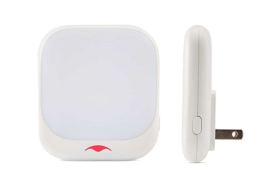 Front and side view of a white square Manta Sleep night light with a red logo on the bottom front edge.