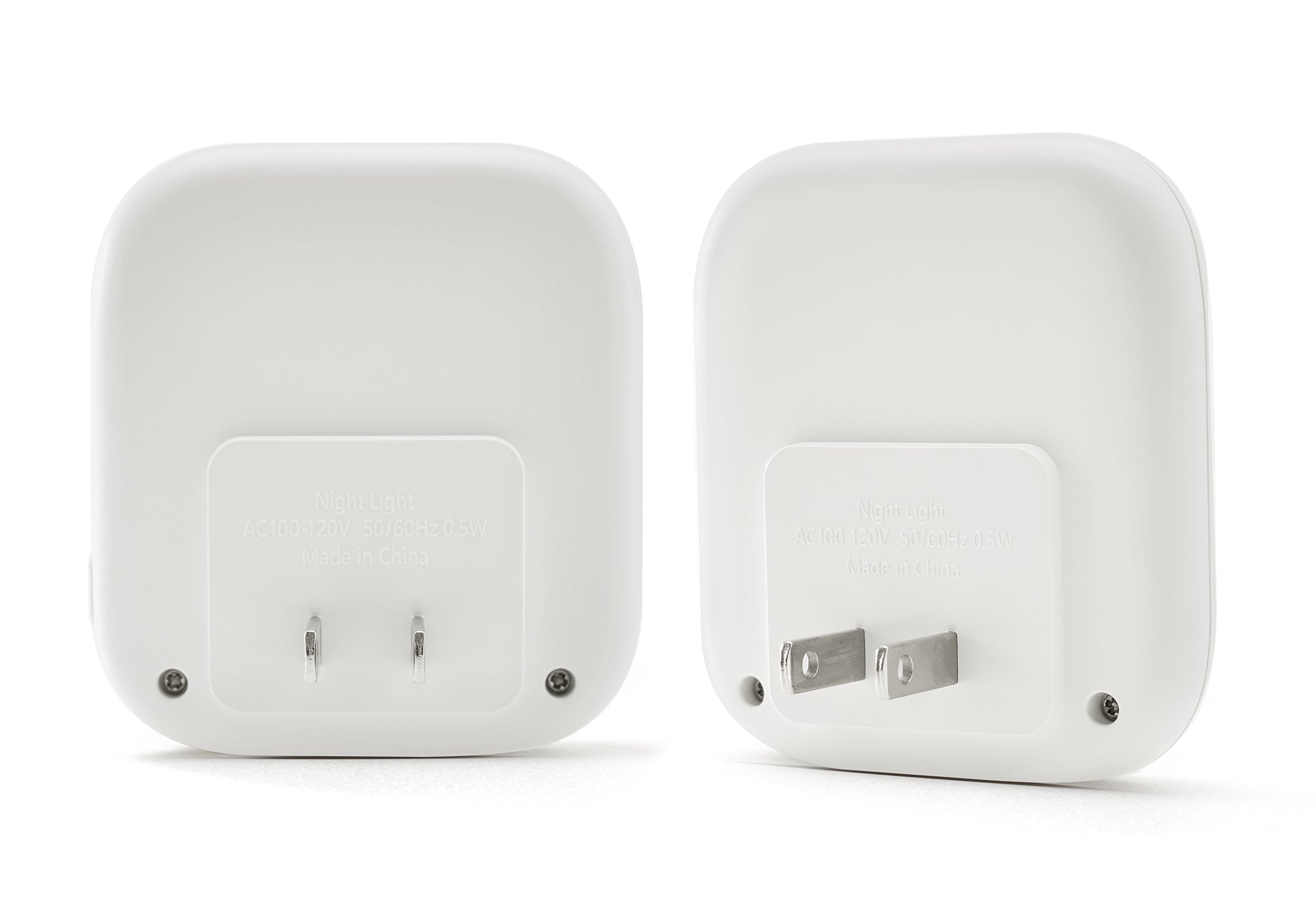 Rear and side angles of two white Manta Sleep night lights showing the integrated wall plug and electrical specifications.