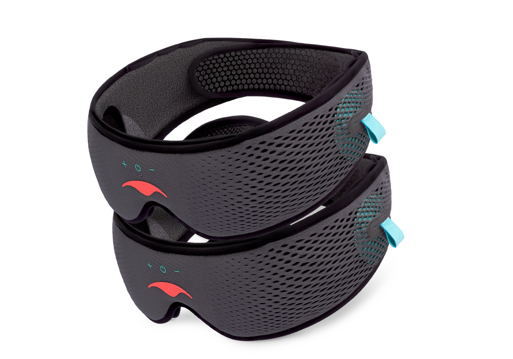 Two grey Manta SOUND Sleep Masks with mesh straps and coral logos neatly stacked on top of one another against a white background.