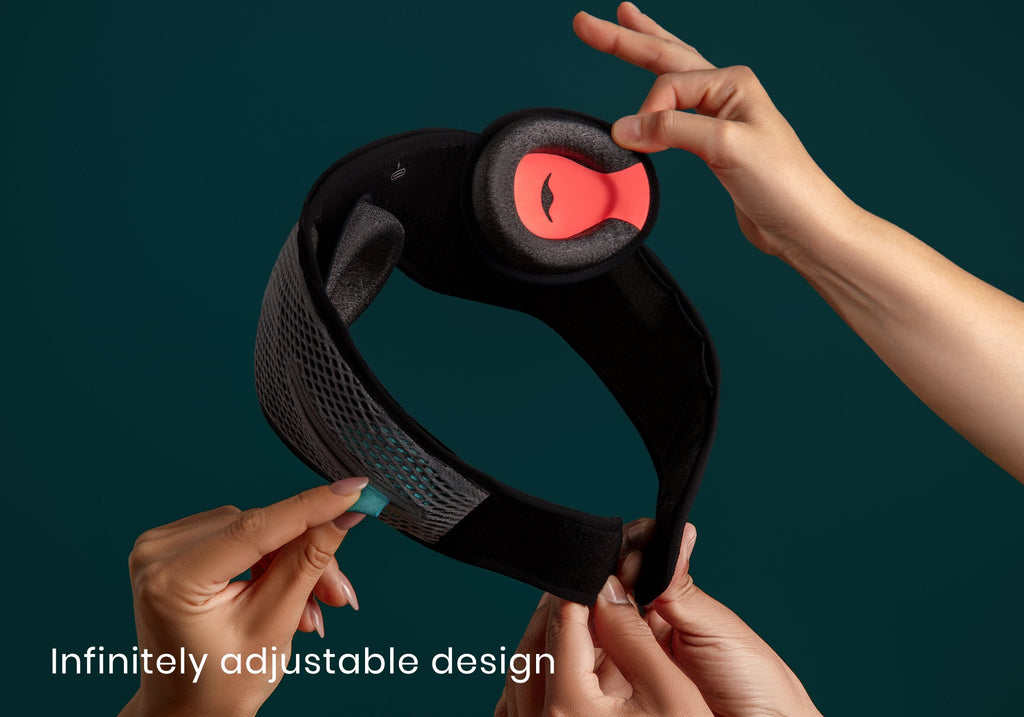Multiple hands adjust the soft eye cups, speaker tabs, and hook-and-loop closure of a grey head strap, captioned "Infinitely adjustable design".