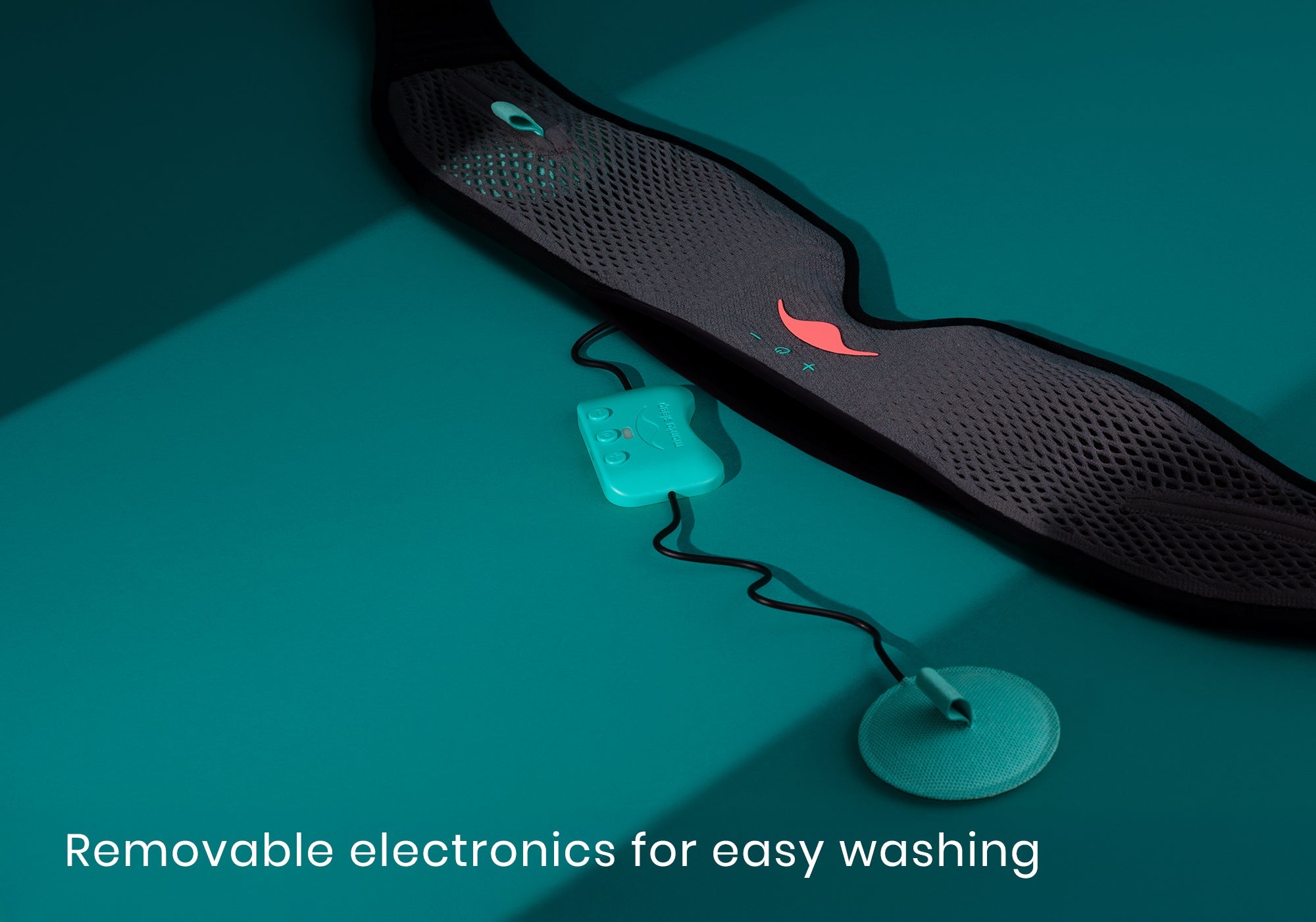 A turquoise Bluetooth controller and wire speaker pulled out from a grey mesh sleep mask on a teal surface, captioned "Removable electronics for easy washing".