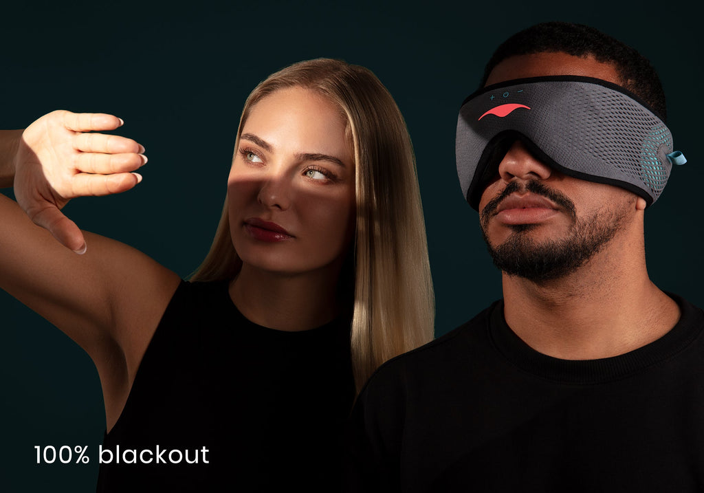 A man wearing a Manta SOUND Sleep Mask next to a woman shielding her eyes from bright light, captioned "100% blackout".