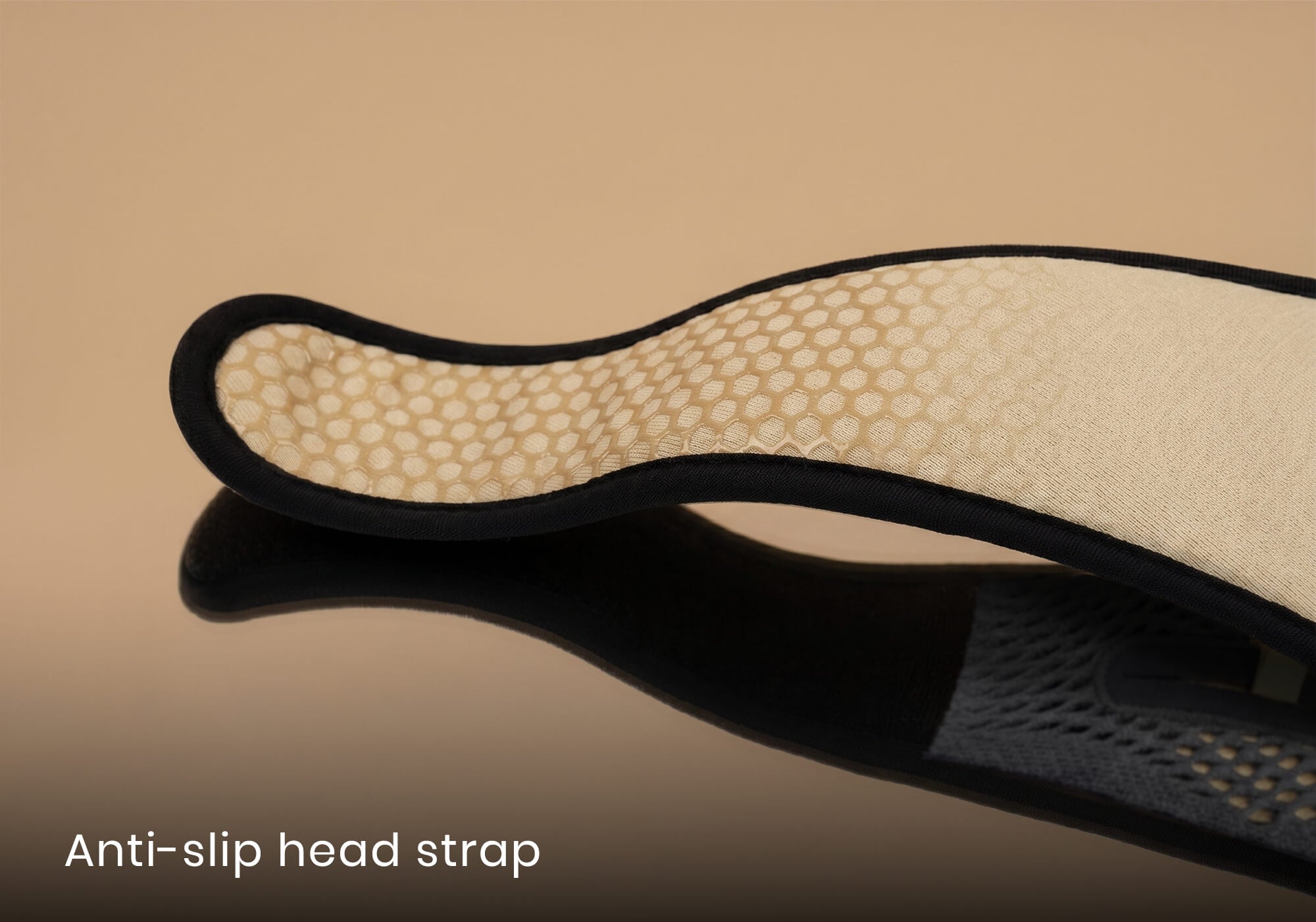 Close-up of the textured honeycomb non-slip lining inside a beige head strap, with text overlay "Anti-slip head strap".