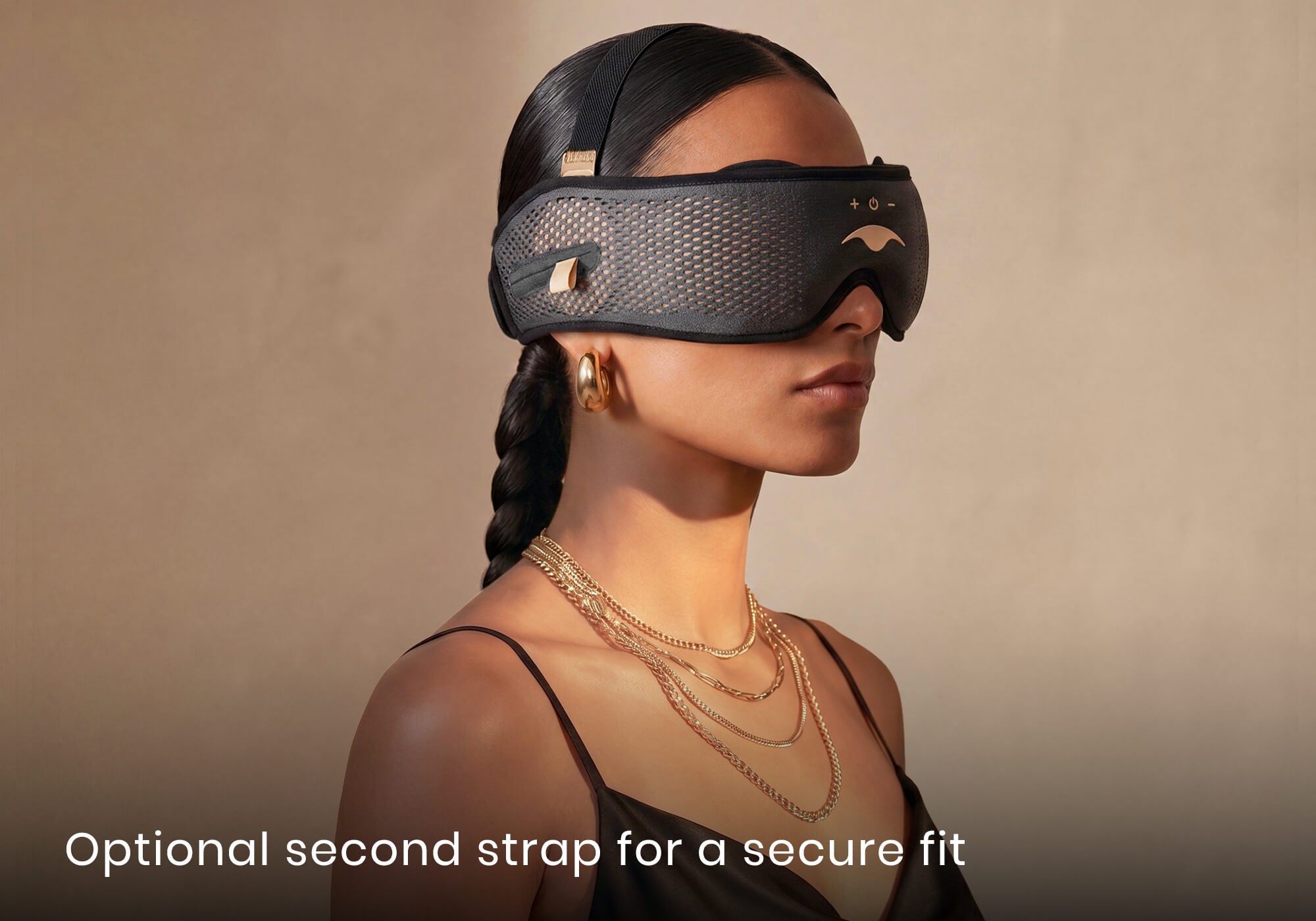 Side profile of a woman with a braid wearing a grey Manta SOUND mask with a thin top strap. Text: "Optional second strap for a secure fit".