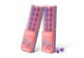 Two boxed packs of Manta Sleep Earplugs standing upright next to a pair of loose purple silicone earplugs, isolated on a white background.