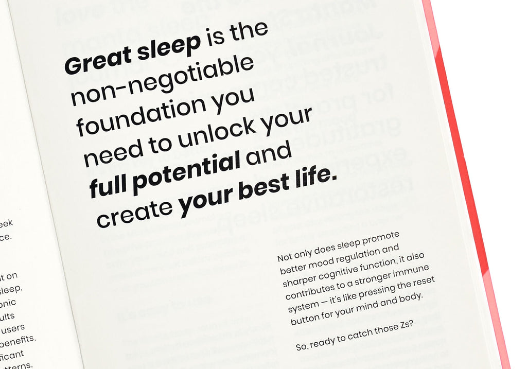 Close-up of an open journal page featuring bold black text starting with "Great sleep is the non-negotiable foundation...".