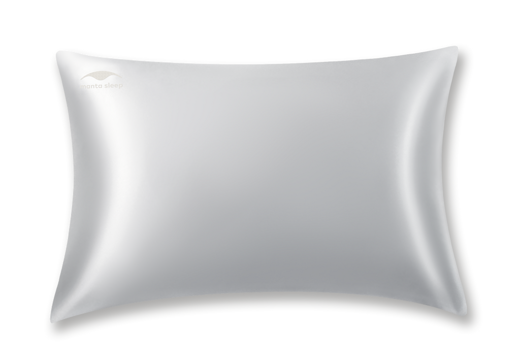 Studio shot of a single standard crystal silver Manta Sleep silk pillowcase with a subtle Manta Sleep logo on the top left corner, isolated on white.