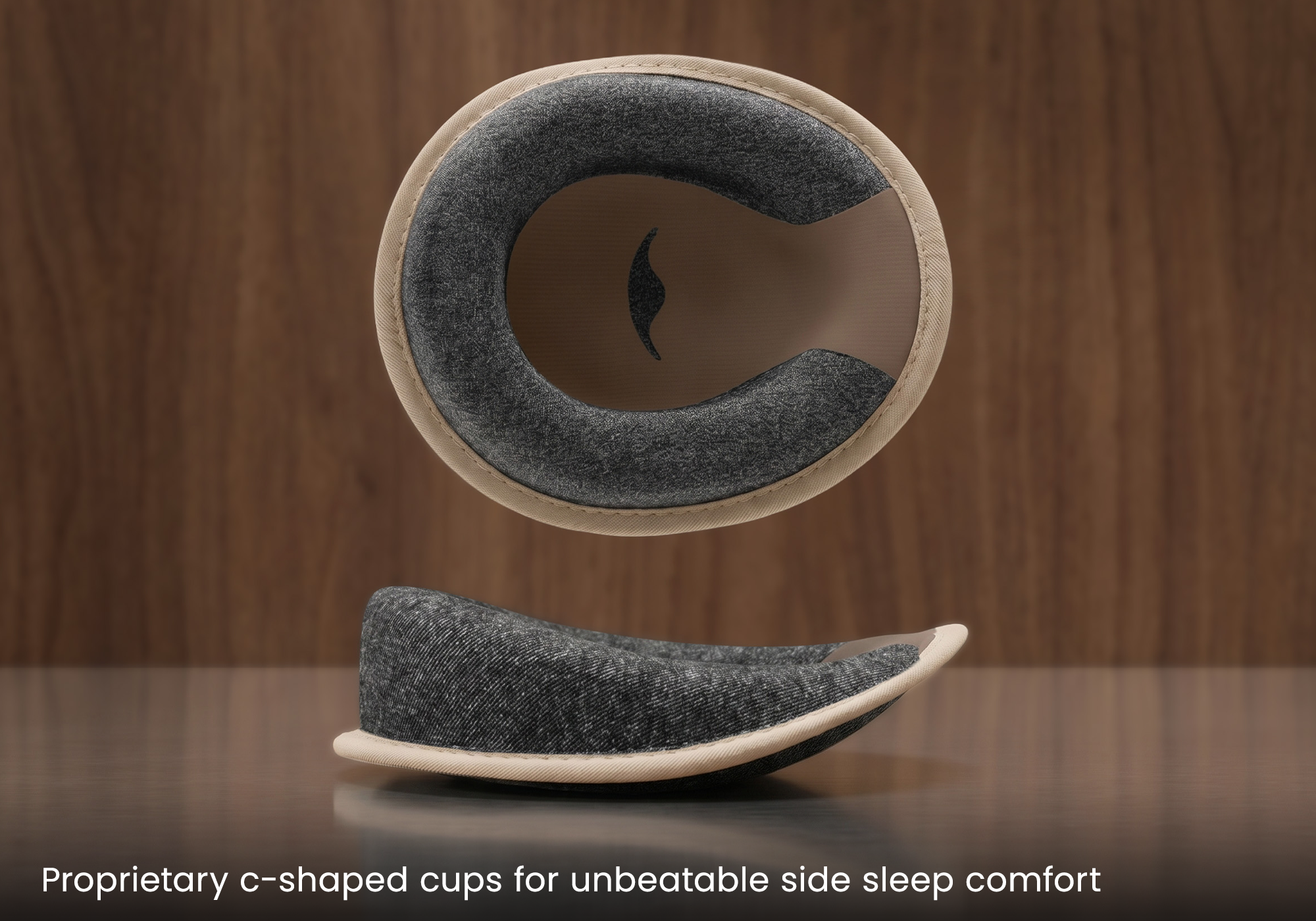 Studio shot showing a single C-shaped grey foam eye cup with a Tranquil Taupe interior, presented from both a front and a side profile view. Captioned: "Propriertary C-shaped cups for unbeatable side sleep comfort".