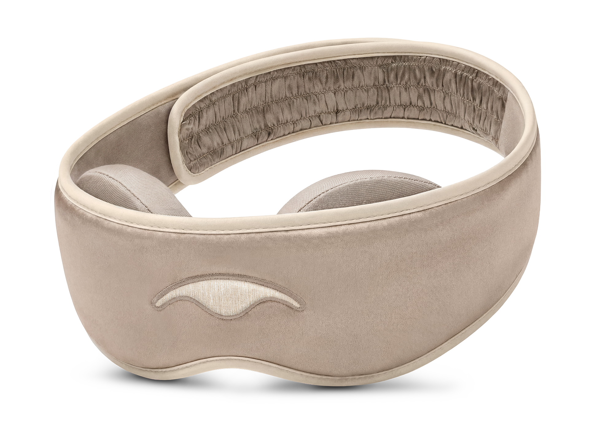 Three-quarter studio shot of the Manta SILK Sleep Mask in Tranquil Taupe, featuring an embroidered beige logo and a ruched back strap section.