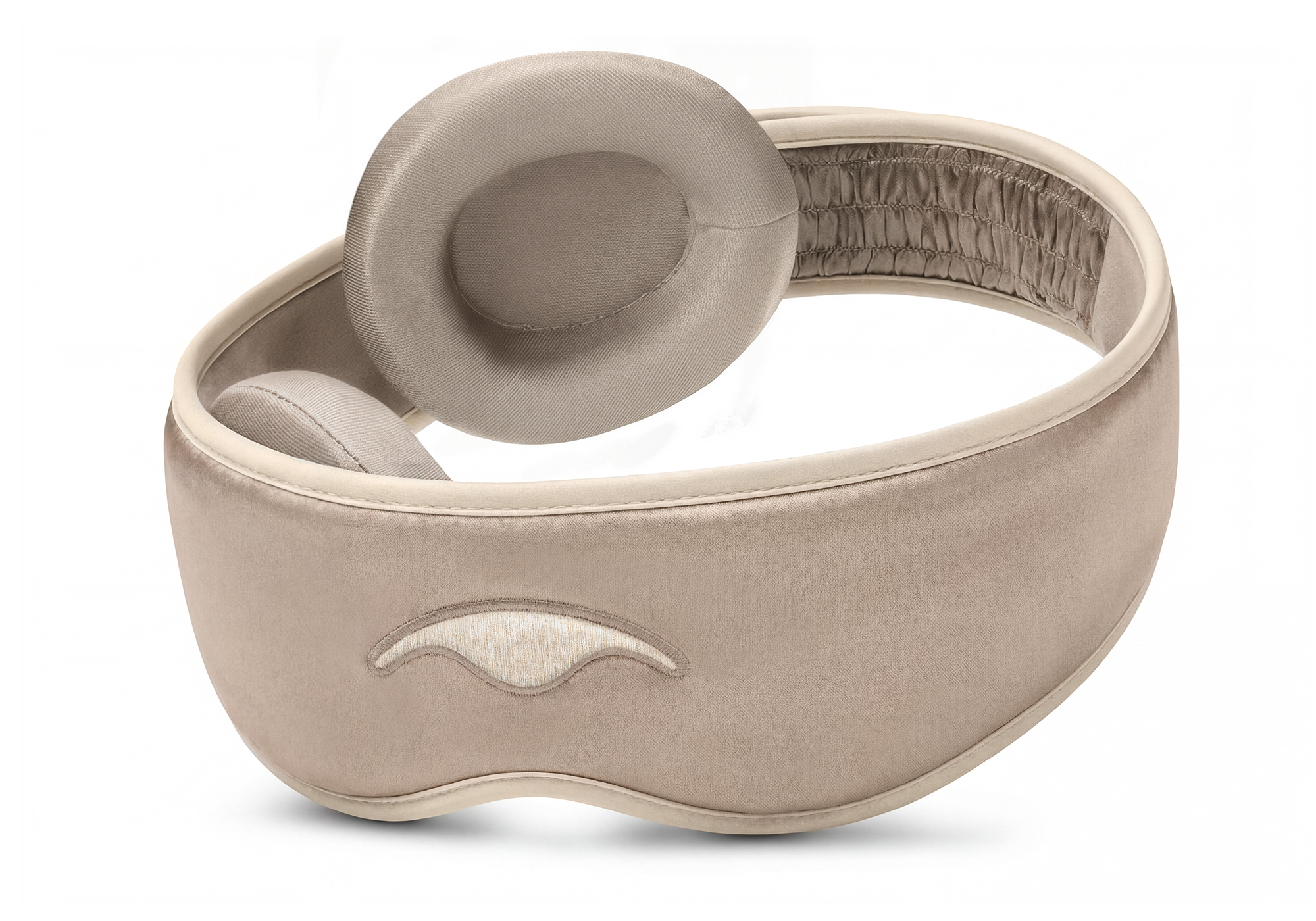Rear-angled view of a Tranquil Taupe silk sleep mask showing a single, thick contoured eye cup and the ruched interior section of the head strap.