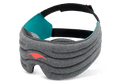 A product shot of the dark heather-gray Manta WEIGHTED Sleep Mask angled against a plain white background. The mask has a segmented, thickly padded front body with a vibrant coral-red Manta ray emblem on the left. The inner lining features a bright teal fabric section on the side panel, transitioning into a wide, adjustable black head strap.