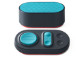 Front view of the oval Manta Sleep white noise speaker with a teal mesh top, paired with its matching teal-buttoned control pad.