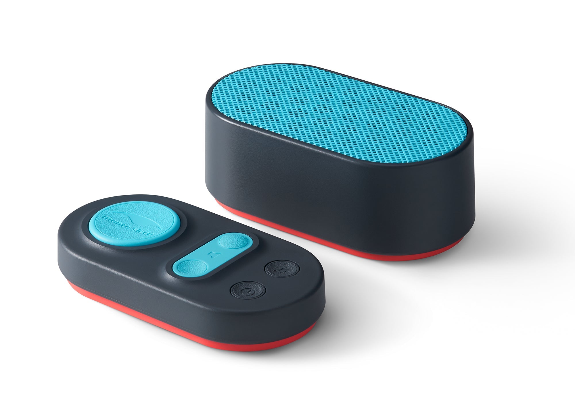 Studio shot of the dark gray and teal Manta Sleep white noise speaker and pill-shaped remote control pad isolated on a white background.