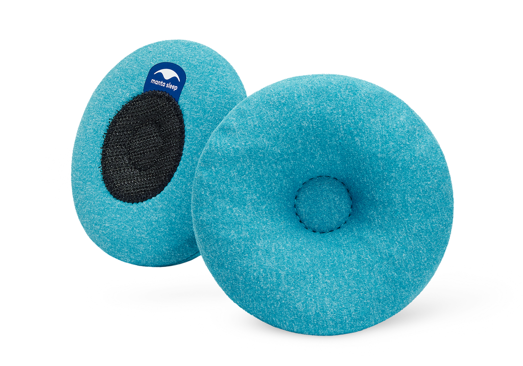 Pair of round blue-teal Manta COOL Eye Cups, showing both the indented front side and the black hook-and-loop back side on white.