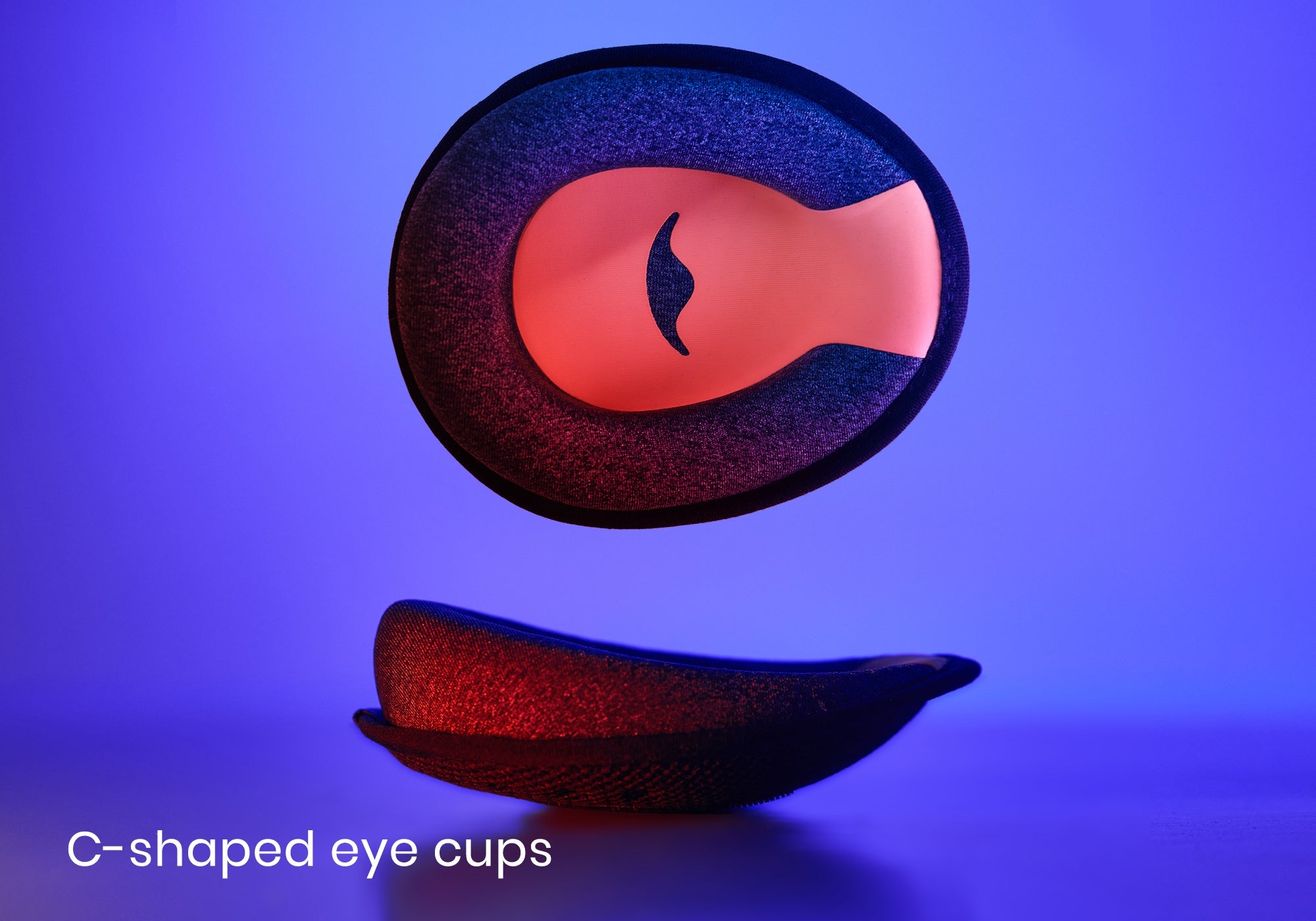 Studio shot showing a single C-shaped grey foam eye cup with a red interior, presented from both a front and a side profile view, captioned "C-shaped eye cups".