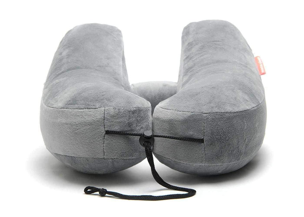 Front view of a grey plush Manta Travel Pillow showing the adjustable black drawstring cord on a white background.